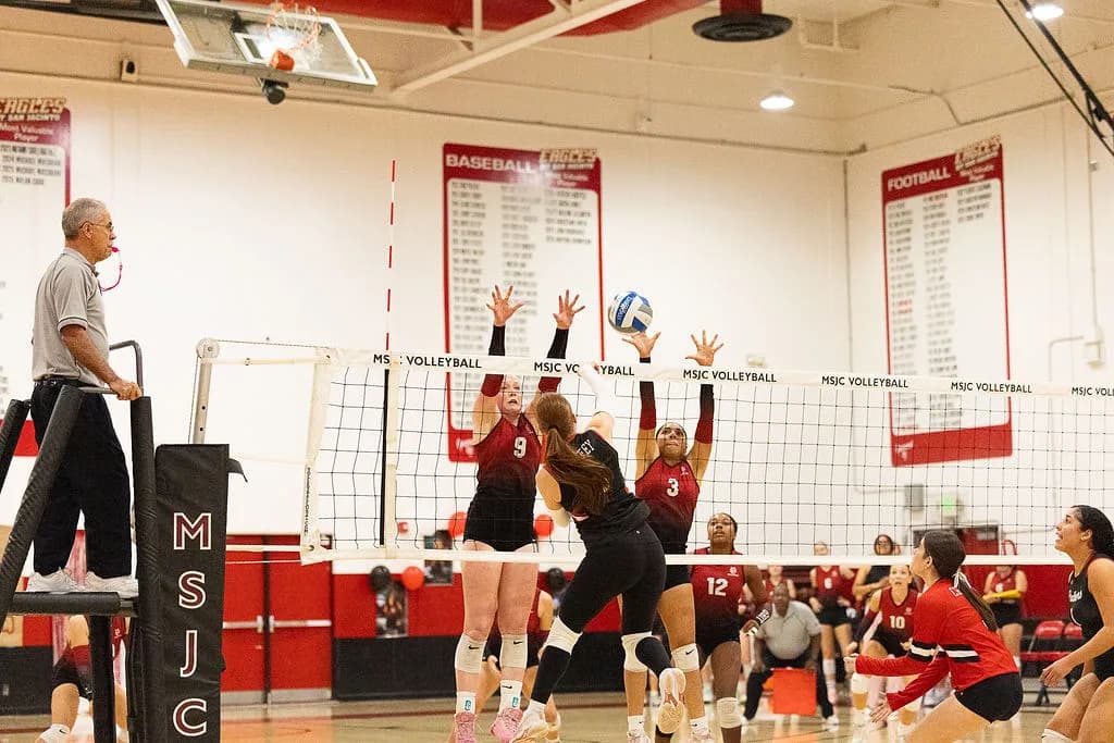 Mt. San Jacinto College hitters Shelsy Delgado (#3) and Dini Schultz (#9) go up for a block at the net tape. Photo by Lisa Zambrano / The Perris Progress.