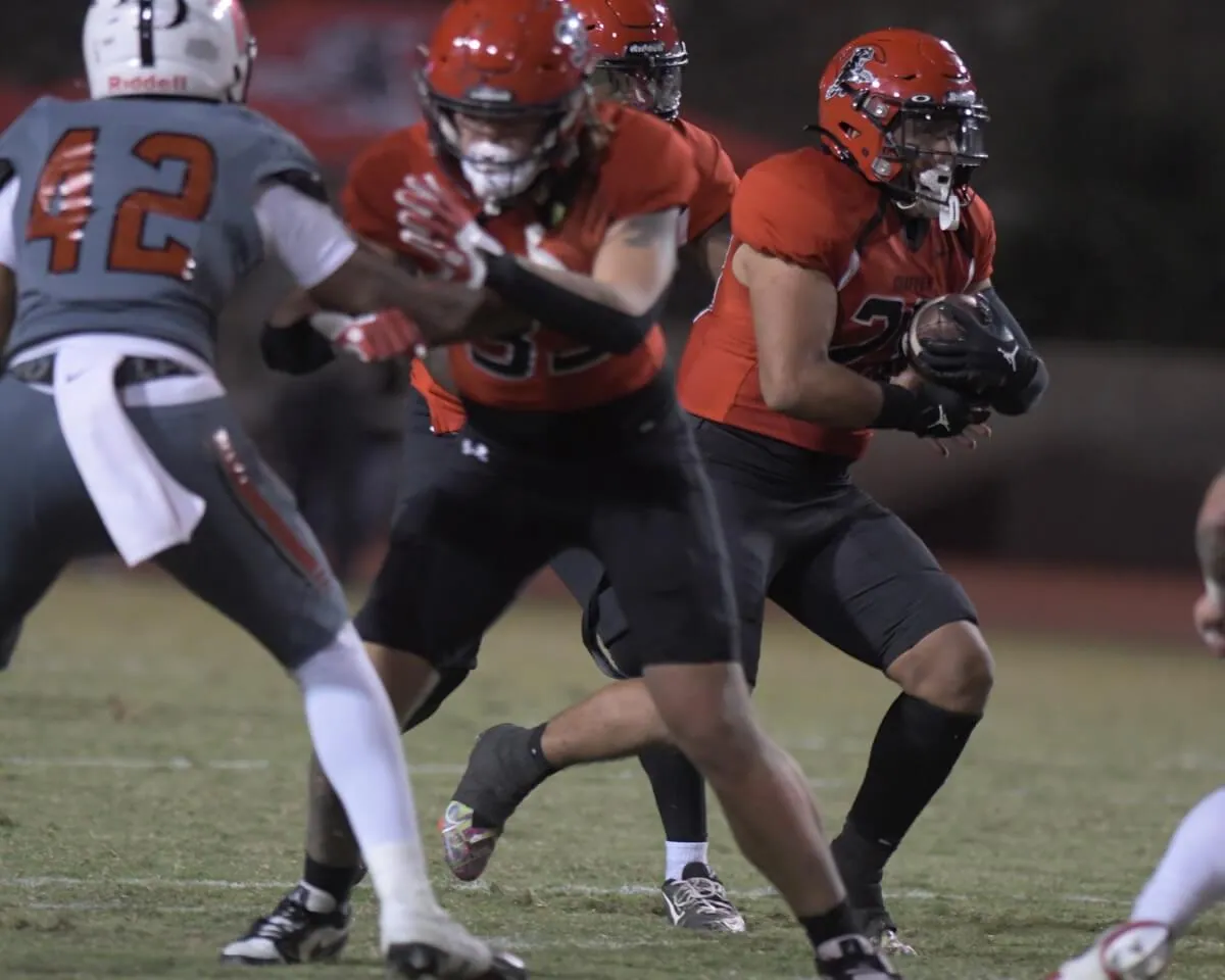 Centennial grad Jayson Cortez runs for some of the 100-plus yards he gained against visiting Santa Ana for Chaffey College Saturday. The Panthers captured the league title with the 34 – 24 win, moving up to #22 in the state poll. Credit: Photo by Jerry Soifer