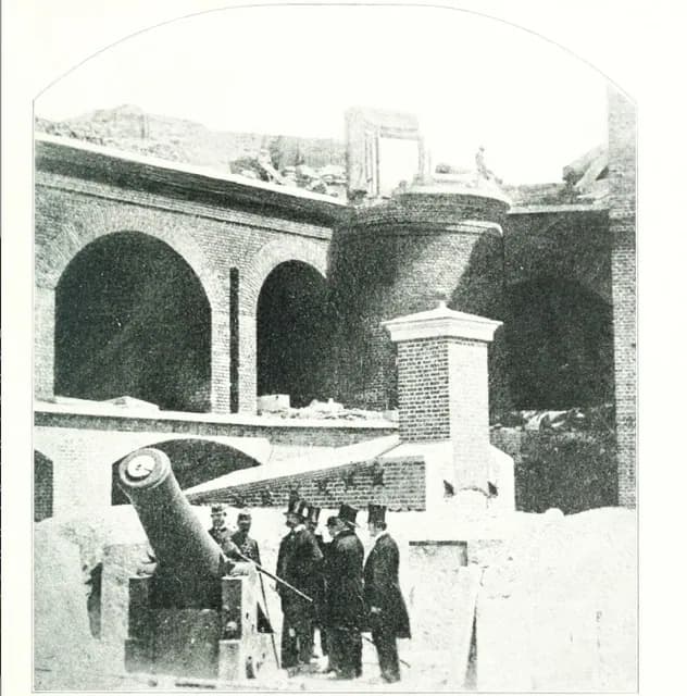 April 12. A photographic view of the Hot shot Furnace at right shoulder angle and a 10-in. Columbiad cannon pointing to Charleston; Ft Sumter April 1861 after its surrender. Credit: New York Public Library