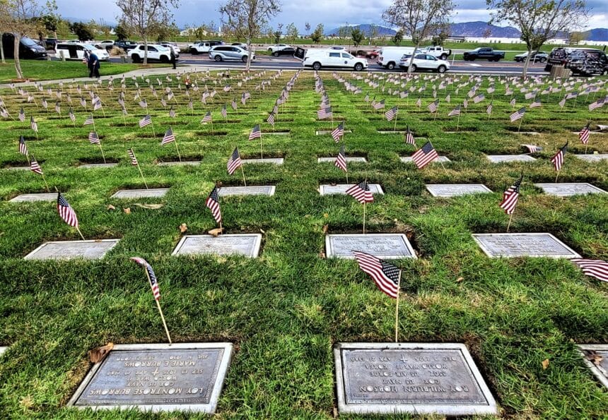 A veteran cemetery on Veterans Day with flags at each grave