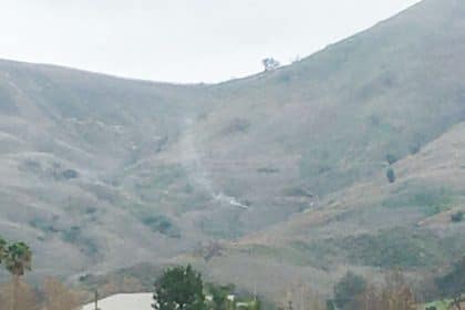 Smoke billows from the Kobe Bryant crash site in the hills of Calabasas, Jan 26, 2020.
