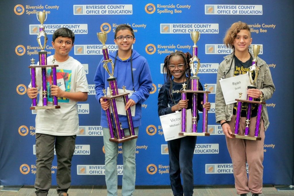 (From L – R) Third place finisher Profess Adhikari, a 6th grade student from River Springs Charter School, first place finisher Avijeet Randhawa, a 7thgrade student from Auburndale Intermediate School in the Corona-Norco Unified School District, second place speller Victoria Michael-Taiwo, a 4thgrade student from Tuscany Hills Elementary School in the Lake Elsinore Unified School District, and fourth place competitor Ryan Scott, a 7th grade student from Eric Stanley Gardner Middle School in the Temecula Valley Unified School District.