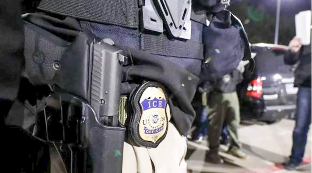 Ex-ICE Agent Photo of Ice badge on hip