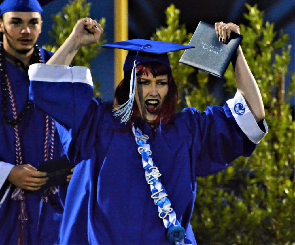 Venus Fulk exults upon receiving her diploma. 