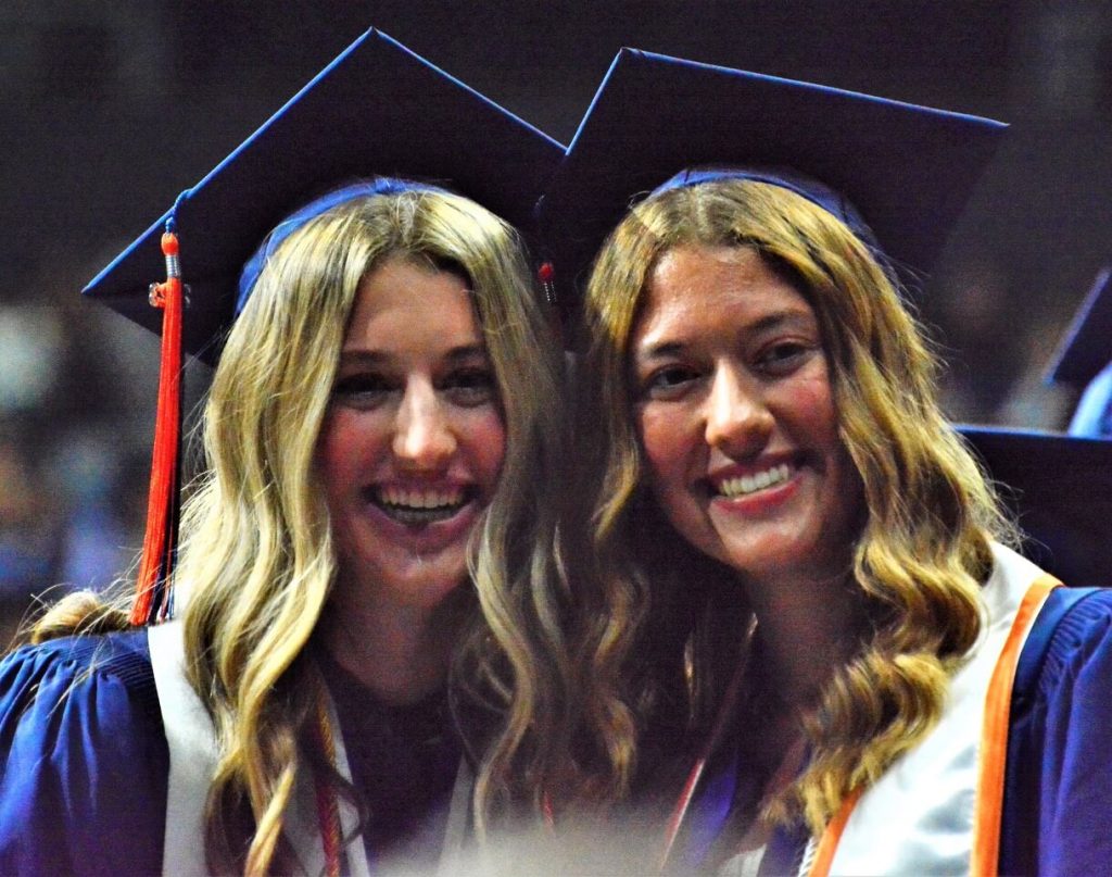 Eastvale Roosevelt volleyball players Terra Whitaker (left) and Alexis Suksdorf (right) smile for a teachers’ camera.