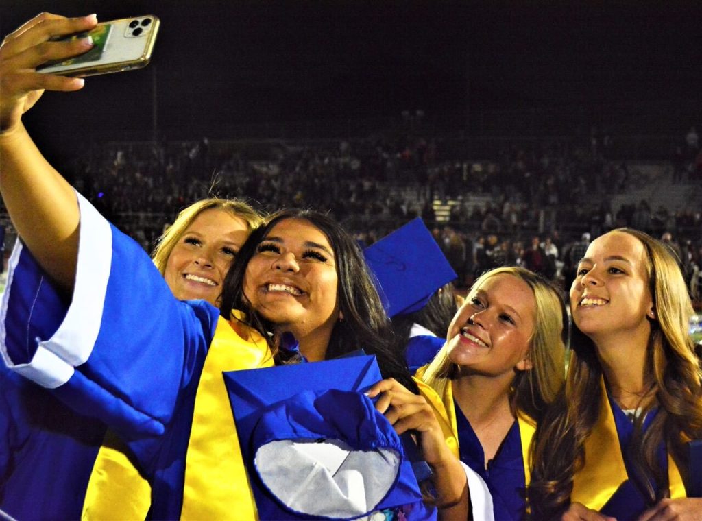 Norco High Softball players Alyssa Hovermale, Mya Perez, Riley Potter, and Rachel Cook smile for a selfie after their graduation last Wednesday night.
