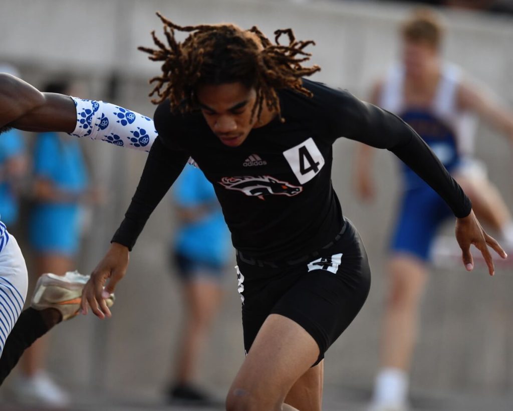 Cayden Roberson, of Eleanor Roosevelt of Eastvale, was involved in a blanket finish of the leading three finalists in the 300-meter intermediate hurdles at the CIF State track and field finals Saturday at Buchanan High in Clovis. Roberson was timed in 37.44 seconds but was assigned third place by the reading of the photo finish camera. Photo by Jerry Soifer