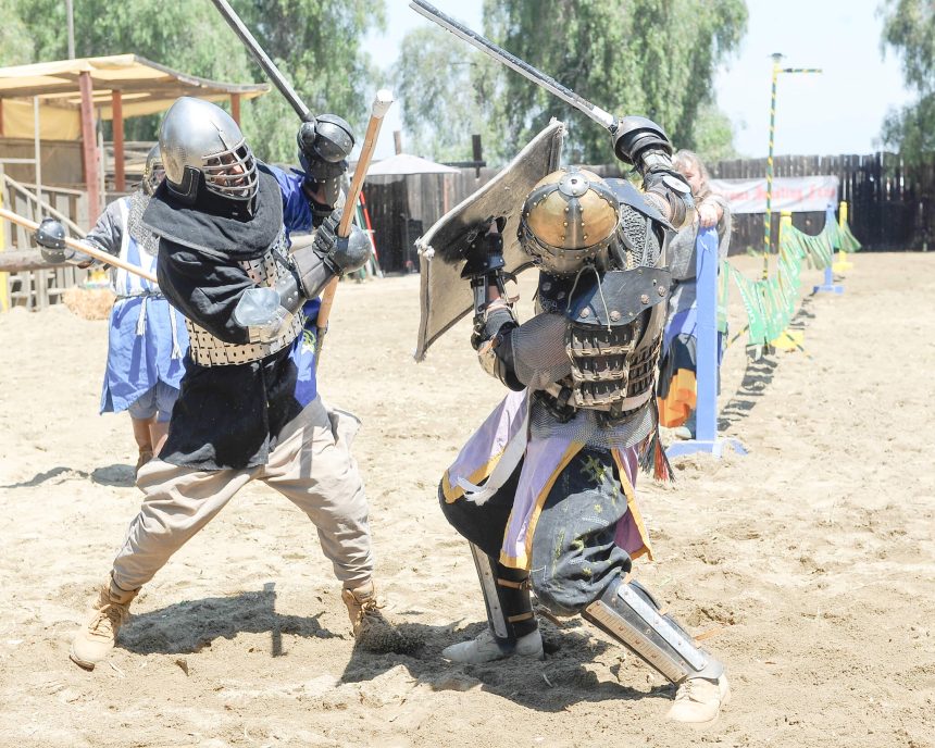 Koroneburg Renaissance Festival soldiers battle with swords Saturday on the next to last weekend of the event in Eastvale. Sword fighting and jousting with lances on horseback were two of many activities that recreated Renaissance history. Photo By Jerry Soifer