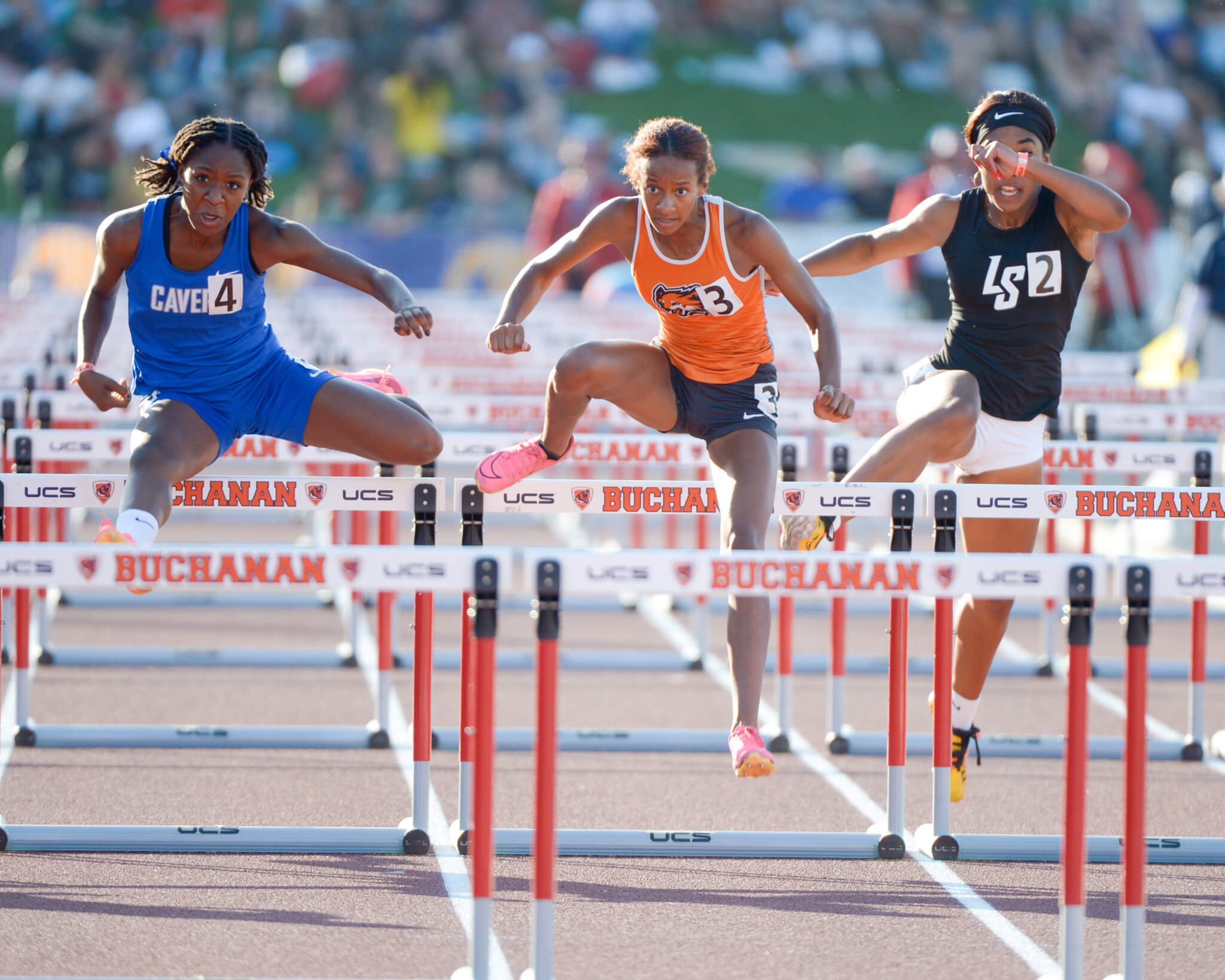Kailah McKenzie, of Perris' Orange Vista High, wearing No. 3, runs to third place in the 100-meter hurdle finals at the CIF State track and field finals at Buchanan High in Clovis Saturday. McKenzie was timed in 13.89 seconds. Kori Fields, of St. Mary's, won in 13.79. Giselle Kirchner, of Rocklin, was second in 13.85. She also took fifth in the long jump and eighth in the high jump. Photo by Jerry Soifer
