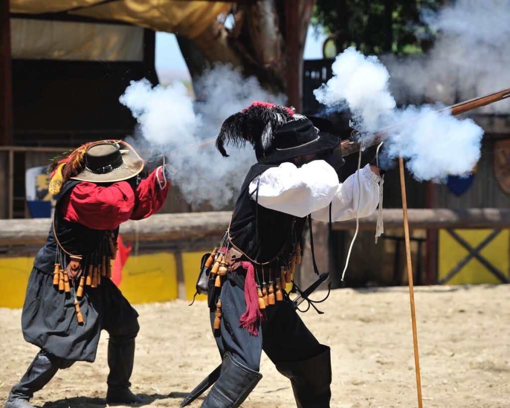 Koroneburg Renaissance Festival Smoke fills the air as soldiers fire their muskets. Photo By Jerry Soifer