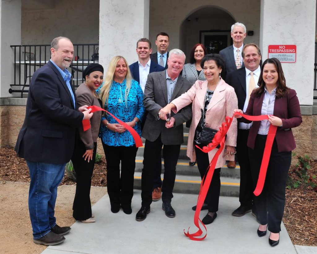 Corona celebrated the opening of the $3 million renovated Harrison Shelter/Navigation Center on Wednesday. City councilman Jim Steiner and former councilwoman Yolanda Carrillo who were instrumental in starting the shelter, are in the center cutting the ribbon. Credit: Photo by Jerry Soifer