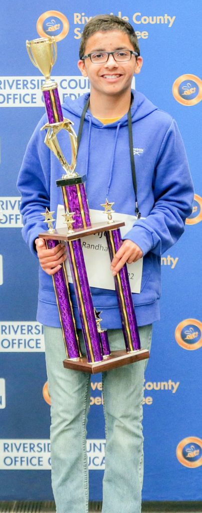 Corona Seventh-grader Avijeet Randhawa, a 7thgrade student from Auburndale Intermediate School in the Corona-Norco Unified School District, holding his Riverside County spelling bee championship trophy earlier this spring. He tied for 12th place in the national bee, having been eliminated in the 12th round.
