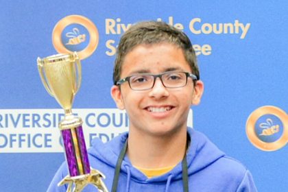 Corona Seventh-grader Avijeet Randhawa, a 7thgrade student from Auburndale Intermediate School in the Corona-Norco Unified School District, holding his Riverside County spelling bee championship trophy earlier this spring. He tied for 12th place in the national bee, having been eliminated in the 12th round.
