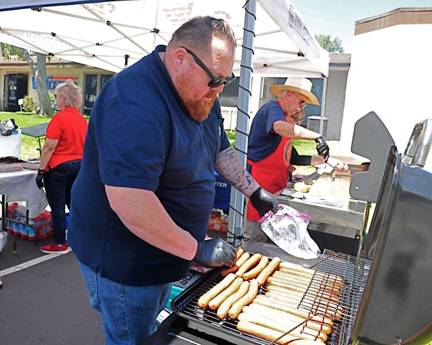 100 Veterans Honored in Corona Friday. Corona Mayor Tony Daddario, left, and retired firefighter and Vietnam veteran Tom Sherman cook the chow for more than 100 veterans who were honored at the Veterans Center in Corona Friday June 30.