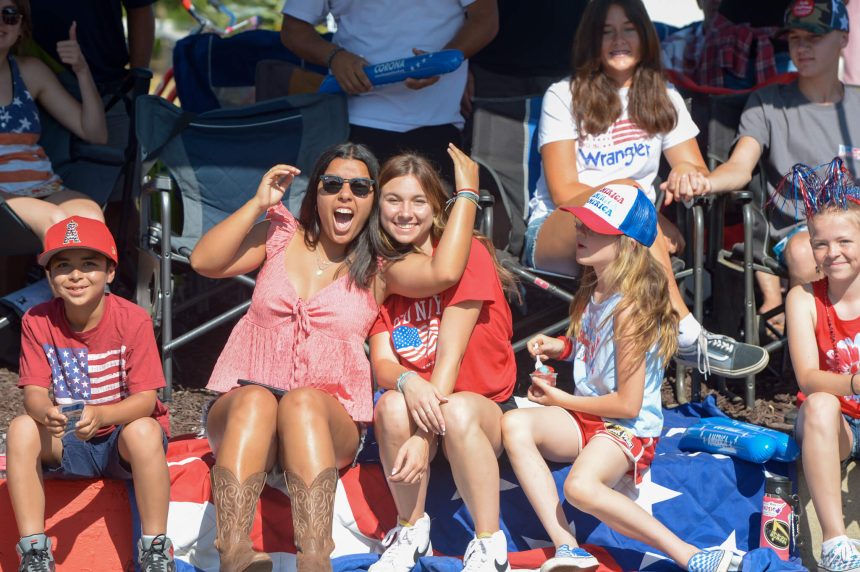 Families enjoying a curbside view of Corona’s Annual 4th of July Parade down Main Street. Photo by Jerry Soifer