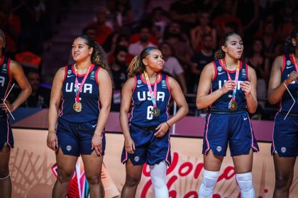 Londynn Jones, (Center #6) draped in gold with her USA teammates after defeating Spain 89-86 for the U19 FIBA Women’s Basketball World Cup.