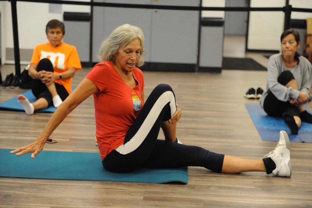 : Calm in the storm as exercise teacher Brenda Gleason leads a class at the Corona Senior Center Monday morning. Credit for all: Photos by Jerry Soifer