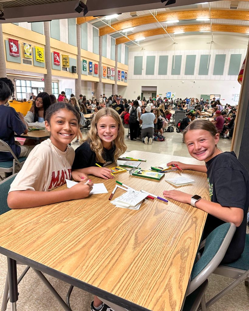 Menifee Students Isabella Sparks, Rylie Stutler, and Journee Lawe were excited for the opportunity to show their support for students of Maui Waena Intermediate Credit: MUSD