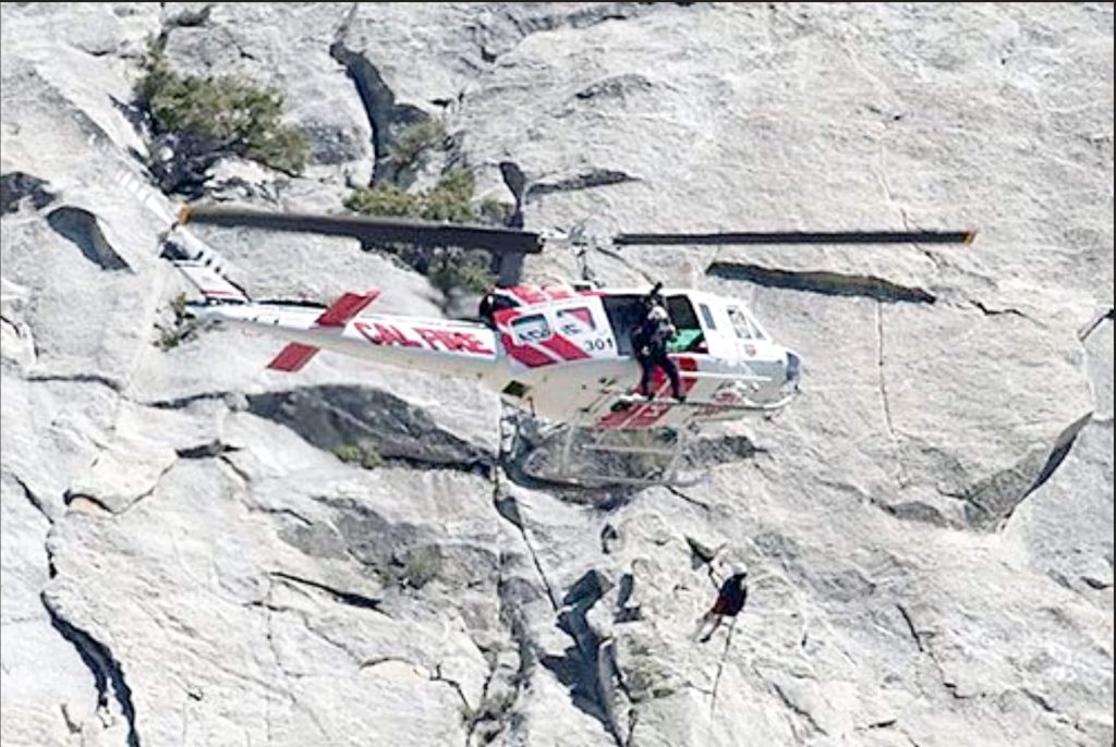 Josh Bischof. "Then Captain Josh Bischof on the strut of Cal Fire helicopter 301 in a 2013 attempted rescue of a fallen mountain climber in Humber Park, Idyllwild." Credit: Photo by Jenny Kirchner of Idyllwild Town Crier, provided by Cheryl Bischof