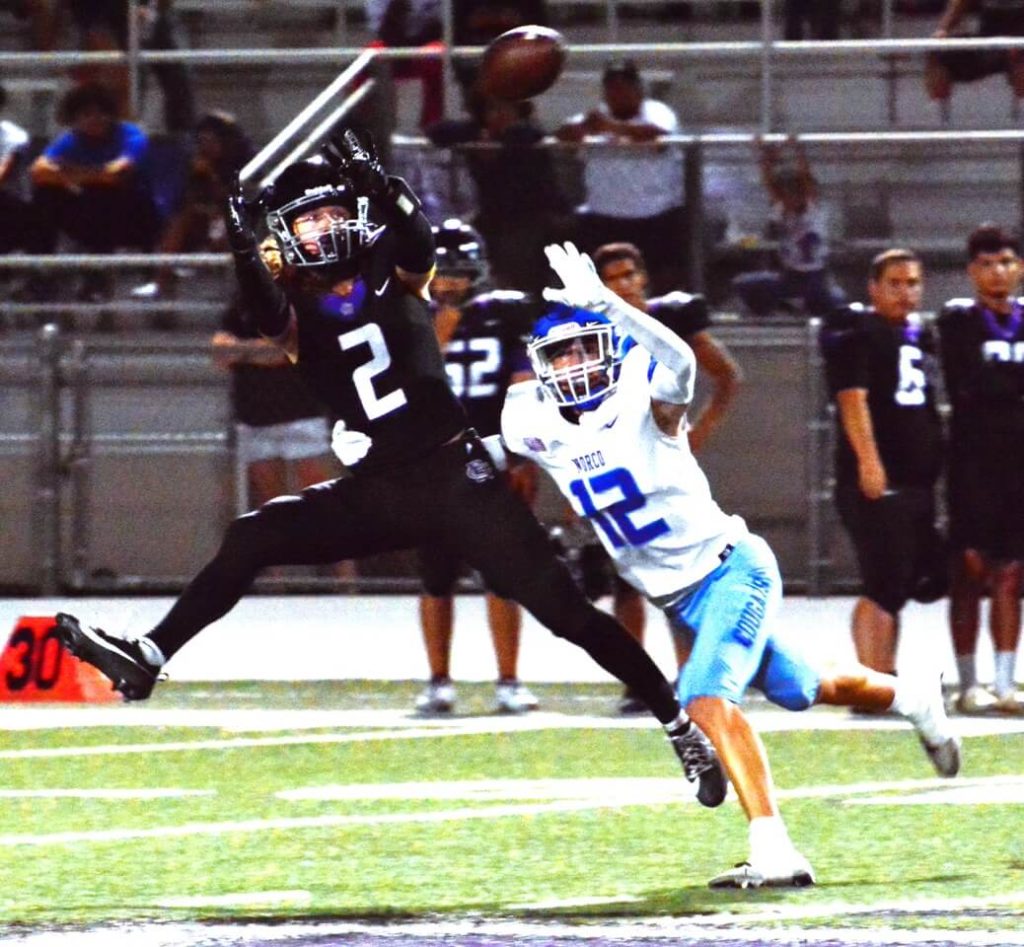 Rancho Cucamonga’s Jonah Dawson (2) catches a pass in front of Norco’s Christian Hernandez (12) during the RC Cougars 21-14 victory over the Norco Cougars.
Credit: Photo by Gary Evans
