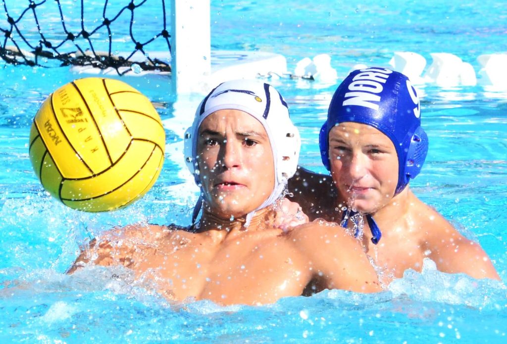 Corona Local Sports 9-22. Jurupa Valley’s Joaquin Huizar (left) and Norco’s Tyler Dejongh (right) eye a pass coming into Huizar. The Cougars defeated the Jaguars 11 – 4.