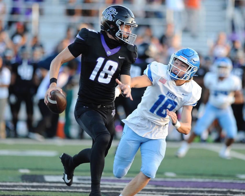 Featured Sports Photos and Football Scoreboard 9-8-2023. Rancho Cucamonga quarterback Tyler Dudden who wore 18 at Norco last year is chased by this year' s No. 18 of Norco, Randy McDaniel. Rancho Cucamonga won, 21-14. Credit: Photo by Jerry Soifer