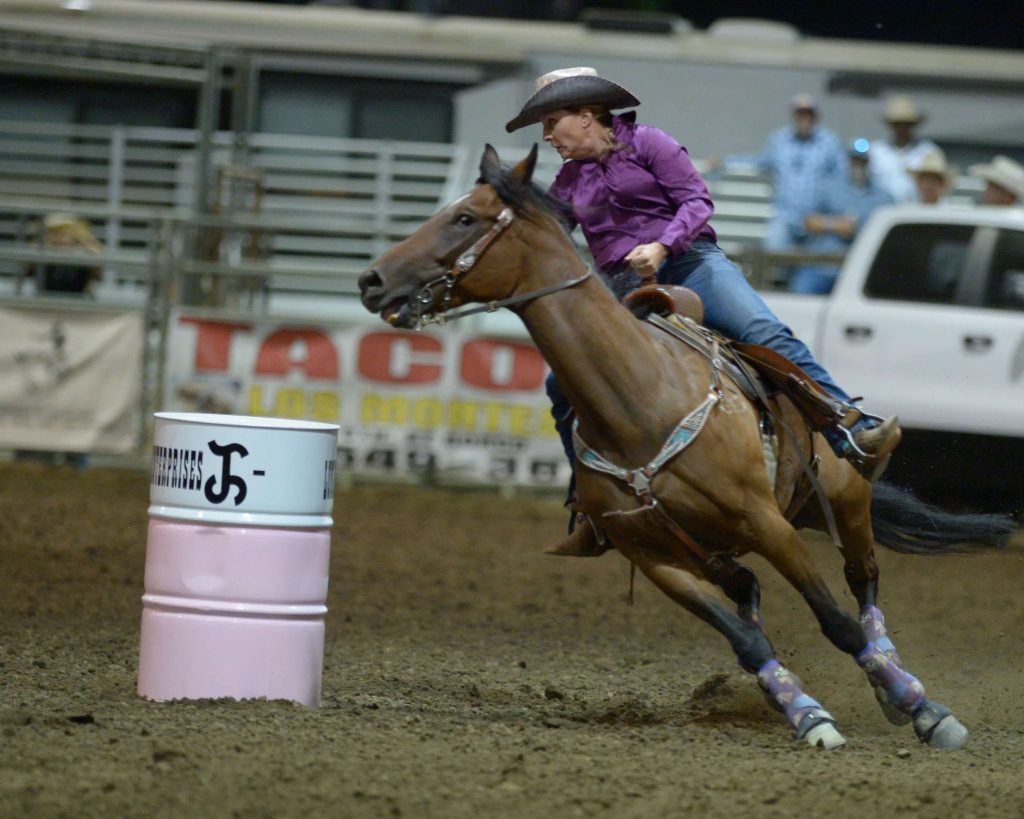 Tonya Burchard, of Menifee, competes in the barrel racing event Sunday at the 37th Norco Mounted Posse PRCA rodeo at the George Ingalls Equestrian Event Center. Burchard 's horse hit a barrel and she was penalized five seconds and did not place.
Credit: Photo by Jerry Soifer
