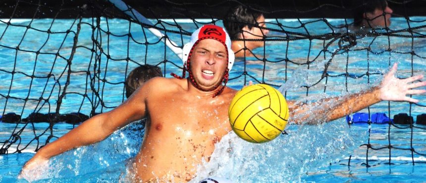 Corona Centennial water polo goalie Maverick Reyes reacts to a Norco shot in the Huskies 18 – 6 victory over the Cougars.