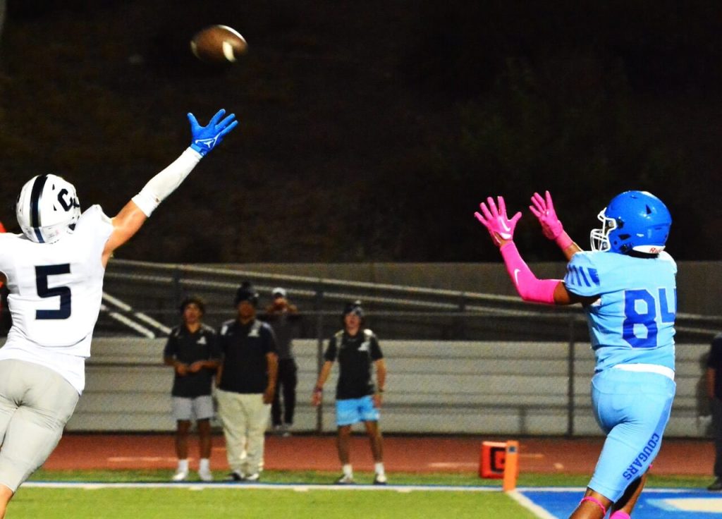 Corona High School Sports photos and Scoreboard. Temecula Chaparral’s Blake Lowe (5) just misses tipping a pass that Norco’s Tyler Riddle (84) catches for a touchdown. The Pumas came from behind to defeat the Cougars 17 – 13.