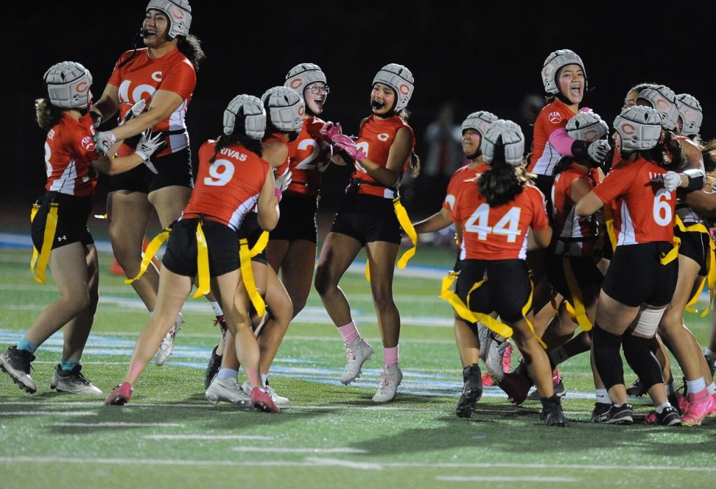The Corona High girls flag football team celebrates its victory over Norco on Monday, capturing the 1st ever Big VIII League flag football title.
Credit: Photo by Jerry Soifer
