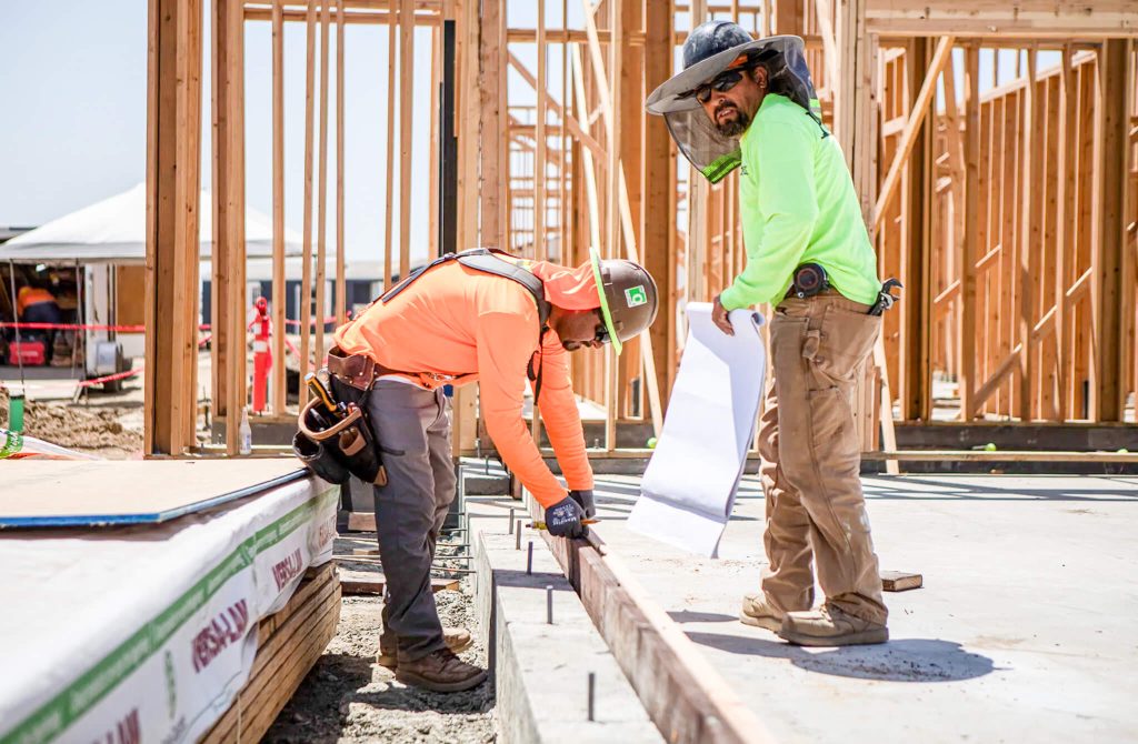 California Poverty. Construction workers on site of a tiny homes village in Goshen on June 2, 2023. Poverty rose to 14% among construction workers in spring 2023. Credit: Photo by Larry Valenzuela, CalMatters/CatchLight Local