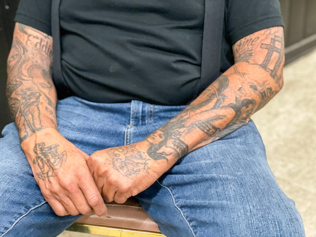 Chaplain Ed Moreno says his tattoos represent many of the ups and downs of his life.
Credit: Photo by Don Ray

