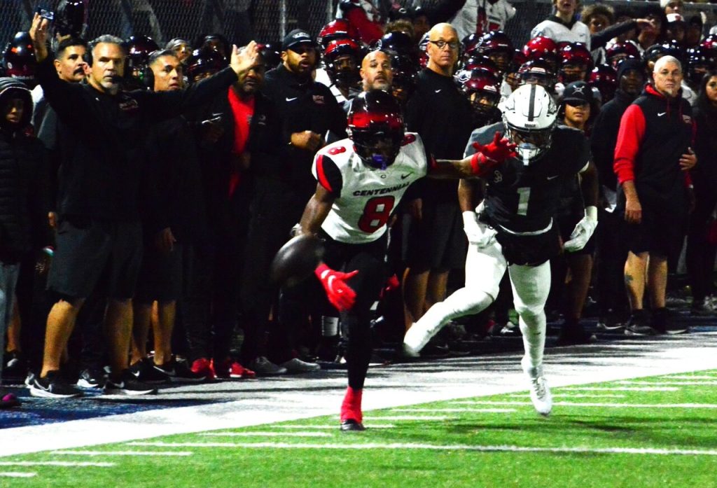 Corona Centennial Head Coach Matt Logan (left, arms outstretched) and the sidelines looks at the back side judge for a call after one of several “offensive” pass interference calls against Huskie receivers during their 43 – 42 CIF Division 1 semi-final loss to St. John Bosco. On this play, Centennial’s Cory Butler Jr. (8) and the Braves Marcellus Williams watch the pass from QB Husan Longstreet fall incomplete.