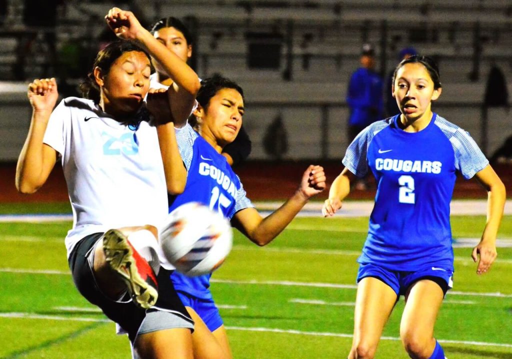 Norco High School Girls Soccer. Montclair’s Dynasty Villanueva (23) and Norco’s Toni Backus (15) have a corner kick bounce off them while Aurina Ponce (2) watches. The Cougars defeated the Cavaliers 4 – 3 in an exciting game.