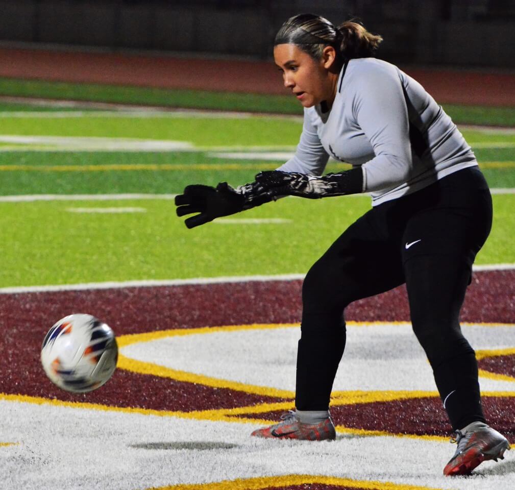 Corona goalie Valerie Lopez gets ready to catch a shot on goal from Hillcrest during the Trojans 3 - 1 victory over the Panthers.
