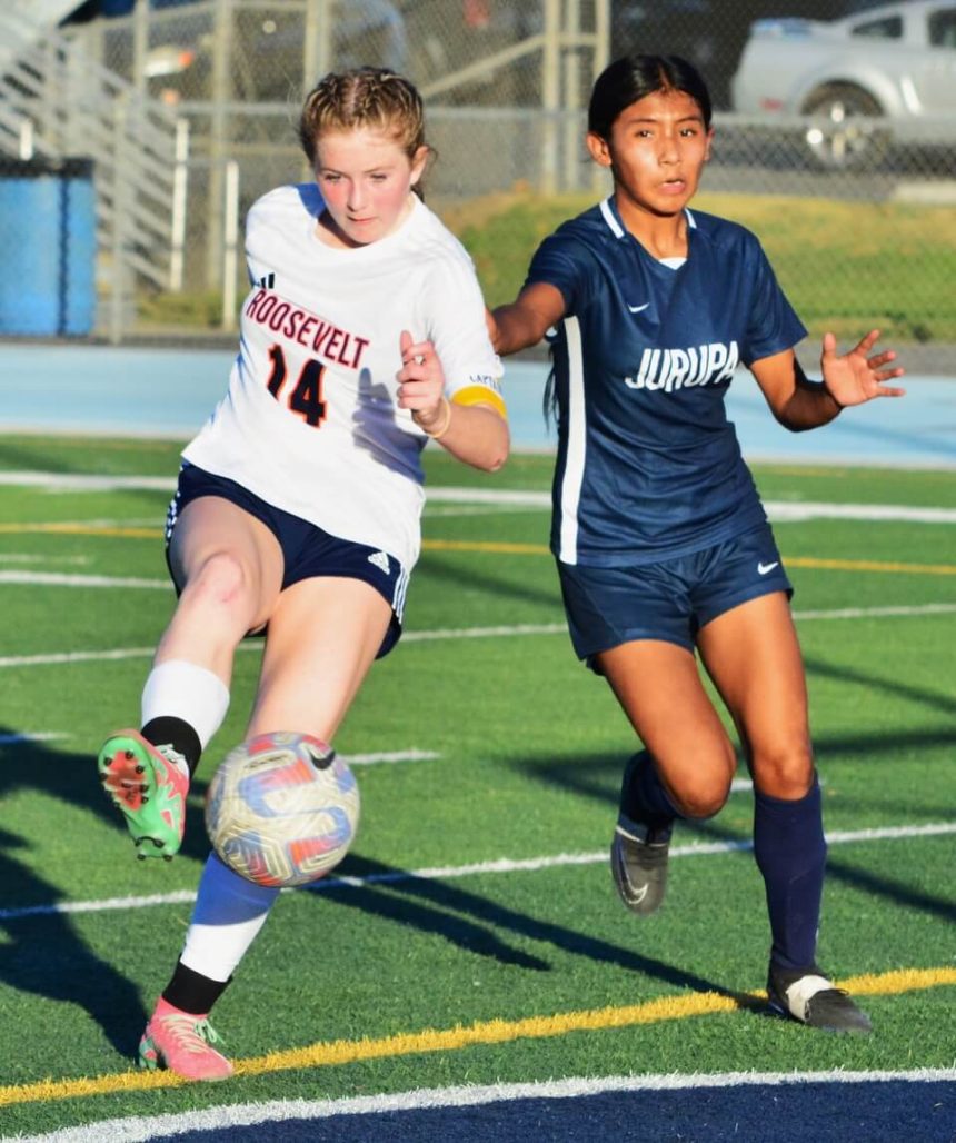 Eastvale Roosevelt’s Ireland Churchill (14) kicks in a goal during the Mustangs 5 – 0 victory over the Jurupa Valley Jaguars