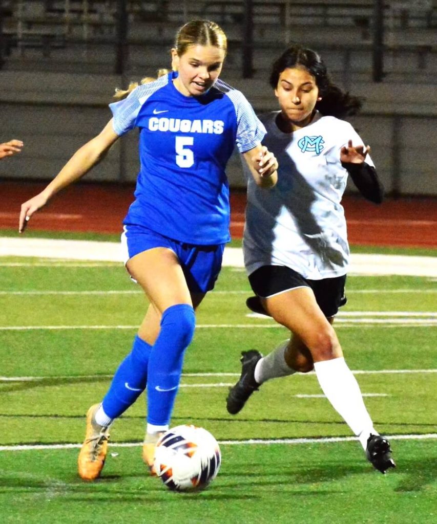 Norco’s Jaylin Young (5) gets ready to shoot on goal while Montclair’s Leslie Zavala (16) tries to catch up. Young scored one of the Cougars goals on the play.