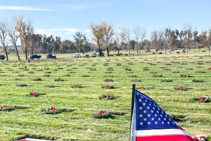 National Wreaths Across America Day. Caption: Volunteers from all walks of life placed holiday wreaths on the graves of veterans resting at the Riverside National Cemetery. Credit: Photo by Don Ray