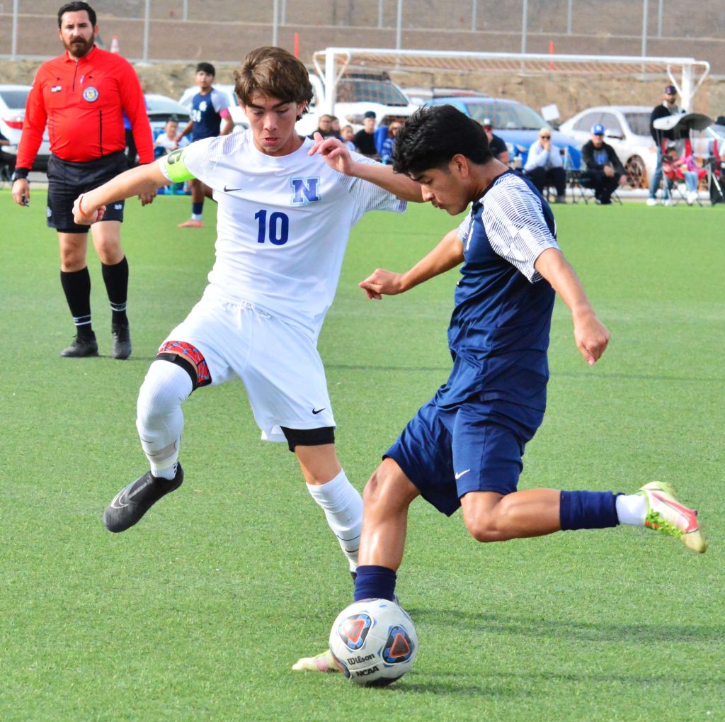 Norco’s Brady Wagner (10) tries to stop Citrus Hill’s Isaac Diaz (right) shot on goal during the Cougars 2 – 0 Winter Classic Tournament Championship game victory over the Hawks.