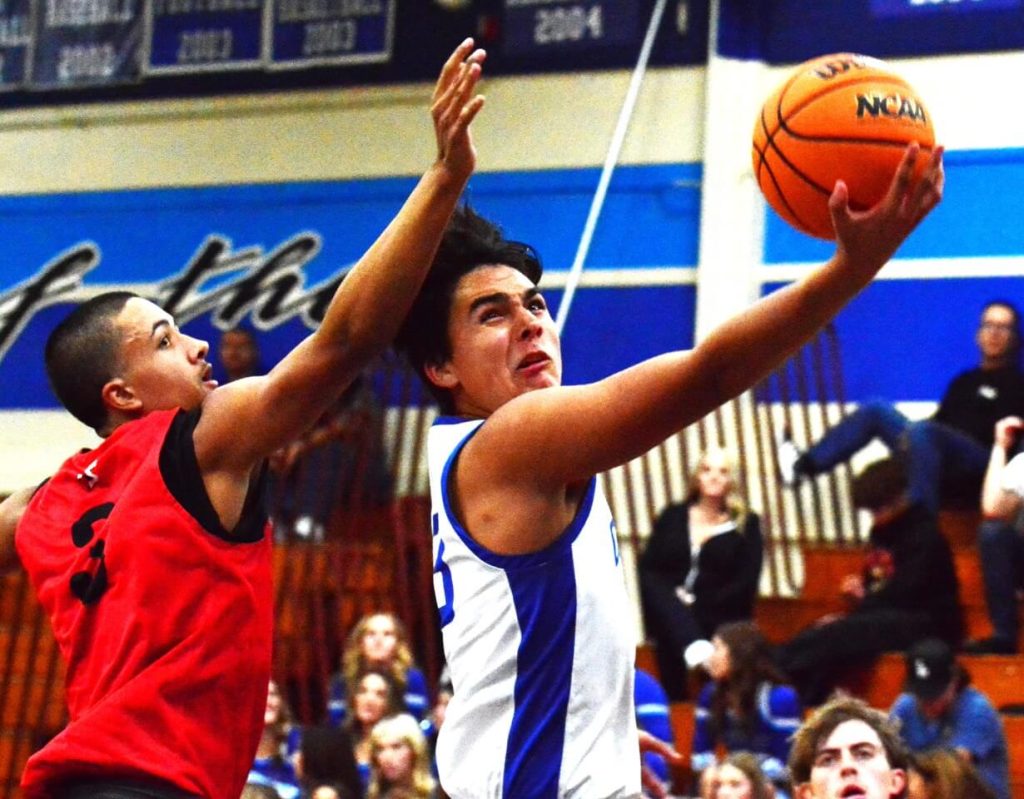 Riverside County High School Sports Featured Photos and Scoreboard 1-12-24Palm Springs guard Jayden Creavalle (3) is a step behind trying to block Norco’s Jose Acosta’s layup.  The Indians defeated the Cougars 59 – 57. 
Credit: Photo by Gary Evans
