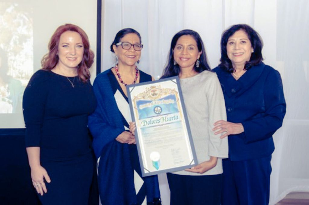 Accompanied by LA County Board Chair, Supervisor Lindsey Horvath (left) and Supervisor Hilda Solis (right) Juanita Chavez (center left) and Maria Elena Chavez (center right) accepted the Yvonne B. Burke Courage Award on behalf of their mother, Dolores Huerta. Courtesy Sup. Hilda Solis