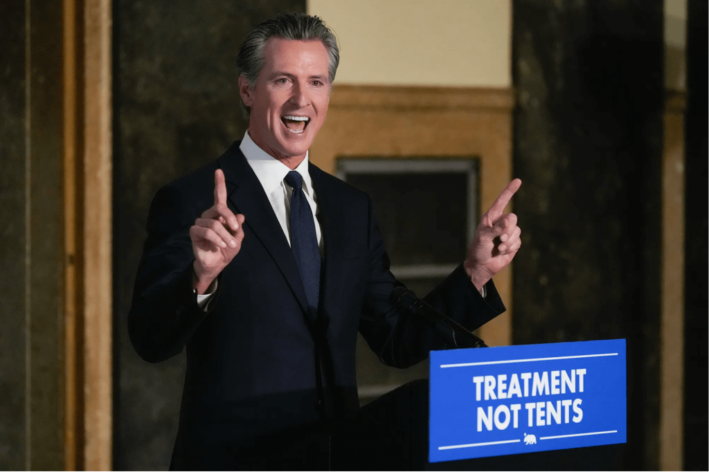 Prop 1. Gov. Gavin Newsom speaks about mental health crisis before signing off on two major pieces of legislation to transform the state’s mental health system and to address the state’s worsening homelessness crisis in Los Angeles, on Oct. 12, 2023. Caption: Photo by Damian Dovarganes, AP Photo