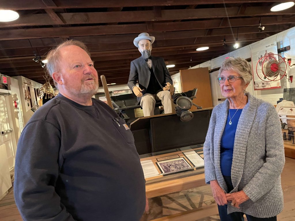 It Takes a Village. Dave Stuart, Fred T. Perris, Midgie Parker Caption: Dave Stuart was responsible for restoring the old Perris Depot. Midgie Parker oversaw the creation of the Fred T. Perris look alike seated on his actual buckboard. Photo by Don Ray
