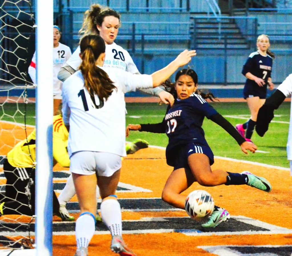 Eastvale Roosevelt’s Juliette Gomez (17) kicks in the rebound of a corner kick during the Mustangs 2-0  CIF playoff victory over Corona Del Mar.  
Credit: Photo by Gary Evans
