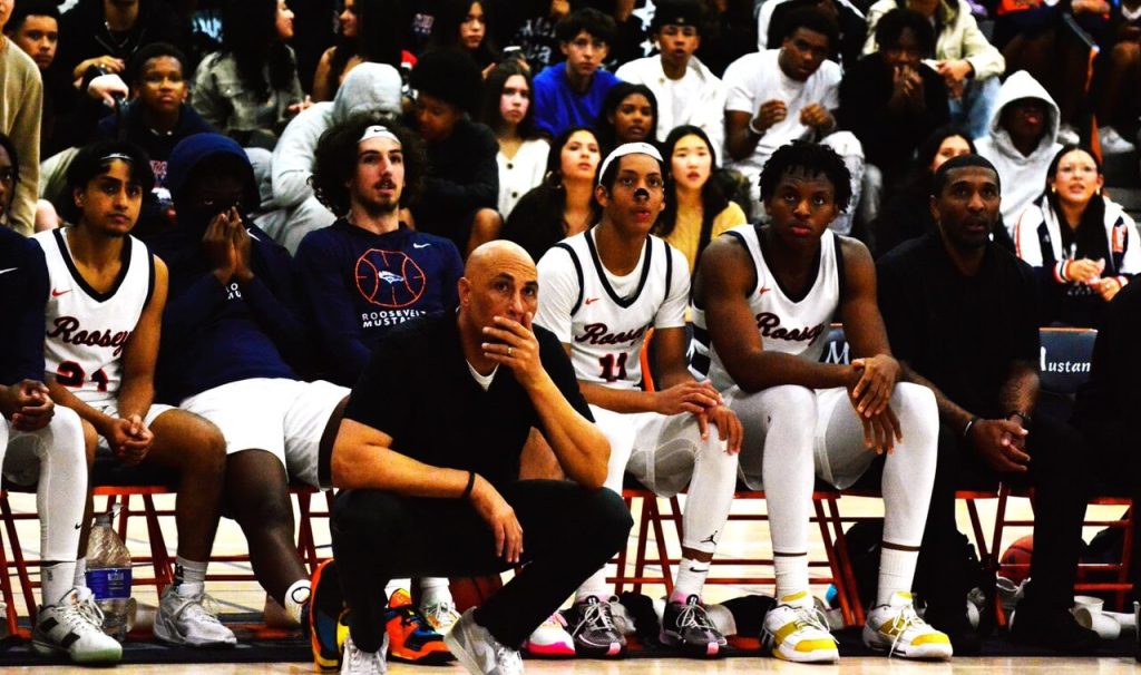 It’s nail-biting time for Eastvale Roosevelt Basketball Coach Steven Singleton (center), his team and their fans, collectively coaxing in the game-winning free-throw in overtime that gave the Mustangs the pool play sweep.  
Credit: Photo by Gary Evans
