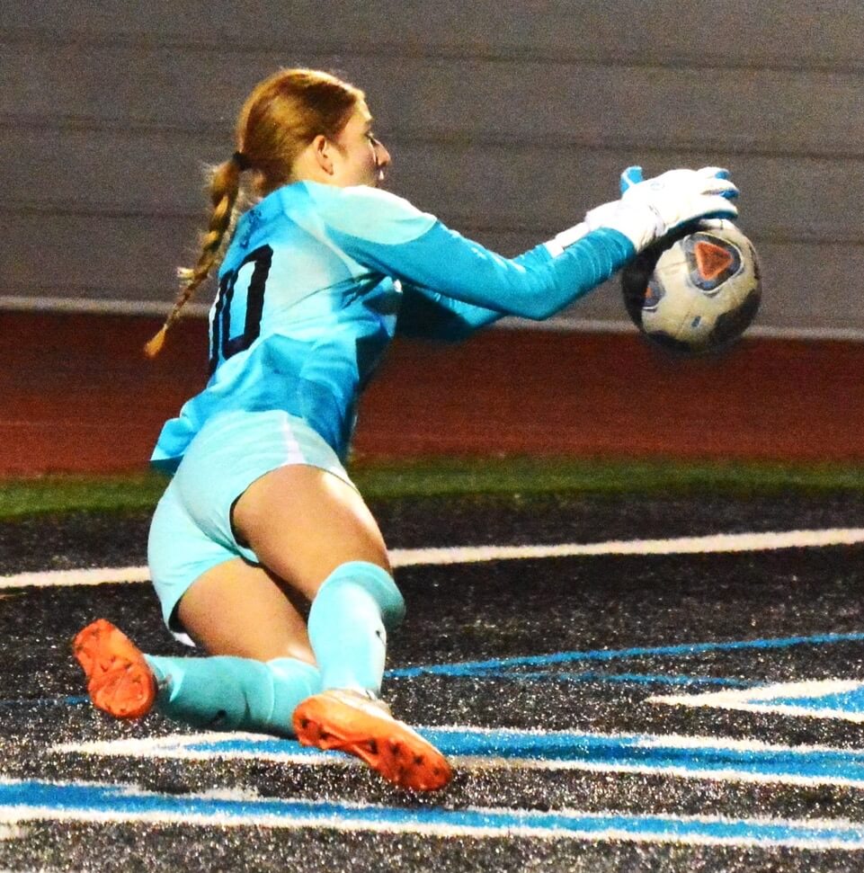 Corona Santiago goalie Abigail Turley makes a diving stop of a Mater Dei shot on goal.  The Sharks defeated the Monarchs 4 -1 and 2 – 0 in the CIF Open Division round-robin playoff format.
Credit: Photo by Gary Evans
