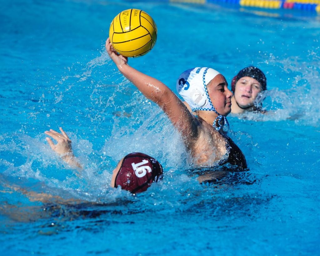 Corona Santiago's Olivia Re scores for the Sharks in a 17-5 rout of Fontana in a CIF second-round water polo playoff game at the Fontana Aquatics Center on Saturday. 
Credit: Photo by Jerry Soifer
