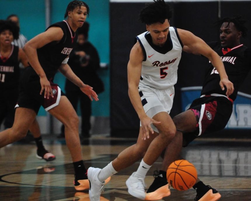 Eleanor Roosevelt's Brayden Burries dribbles past Centennial's Eric Freeny in the Big VIII League tournament final Friday, 2-2-24. Berries scored 31 points and pulled down 11 rebounds to lead Roosevelt to a 63-50 win in the Corona Santiago gymnasium. Credit: Photo by Jerry Soifer