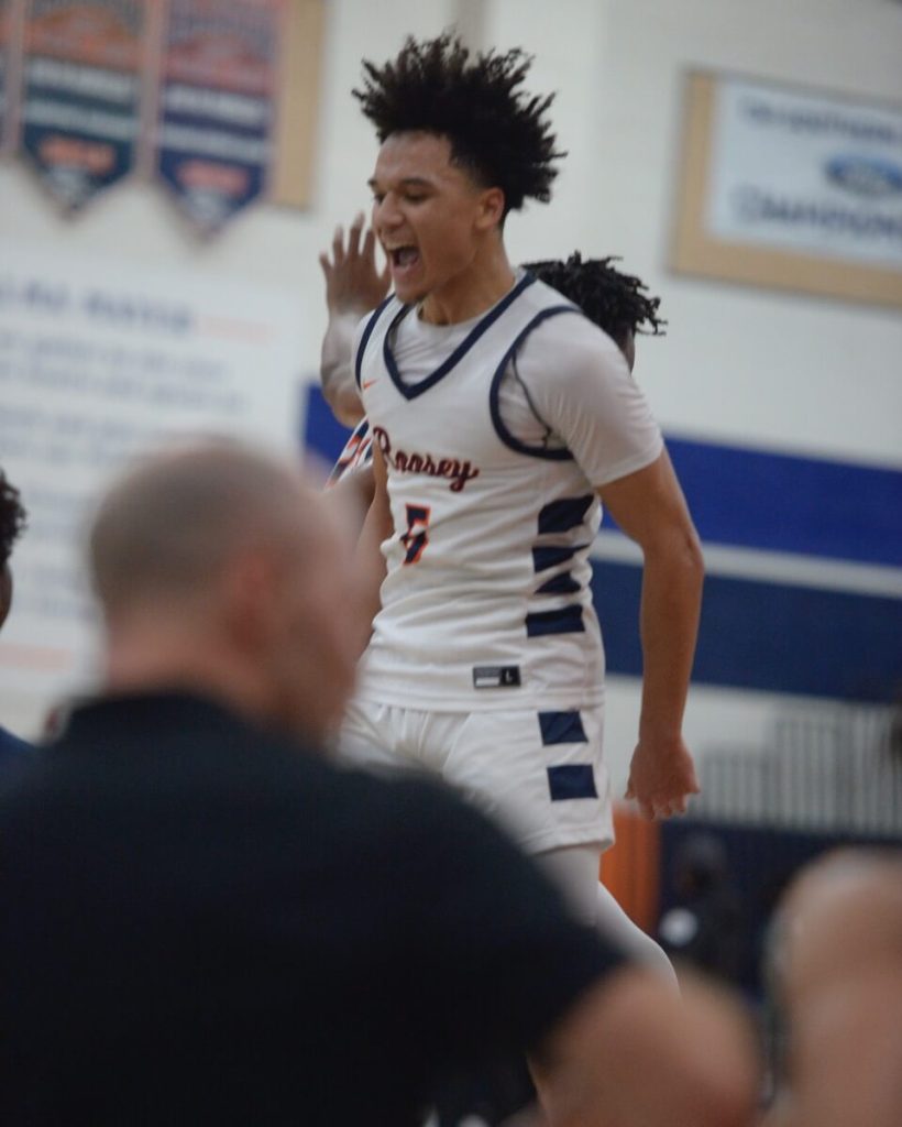 Eleanor Roosevelt's Brayden Burries celebrates the team victory after dropping 21 points in a 64-59 win over Pius X-St. Mattias in a CIF Open Division pool play game on Tuesday. The Mustangs beat JSerra in an earlier game, photo on Page 10
Credit: Photo by Jerry Soifer
