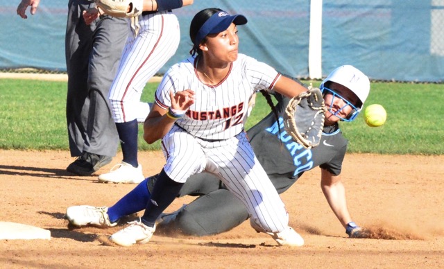 Norco’s Tamryn Shorter steals 2nd base ahead of Eastvale Roosevelt’s Lotoleilei Sivas (12) receiving the throw. The Cougars defeated the Mustangs 4 – 3. Credit: Photo by Gary Evans